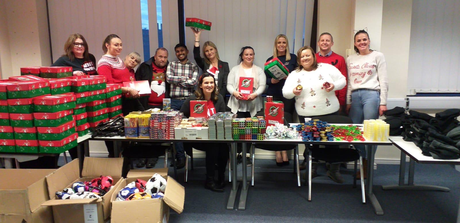 Staffing Match Operation Christmas Child 2019 - team with boxes of gifts