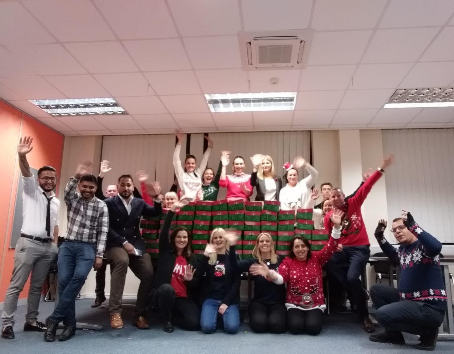 Operation Christmas Child - team with packed boxes
